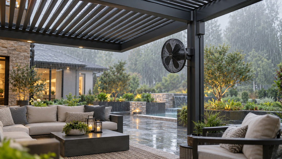 Post-mounted pergola fan sheltered beneath motorized louvers during light rain
